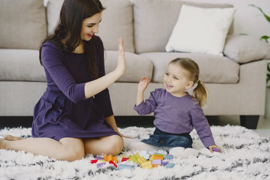 A Nanny Playing with a child.