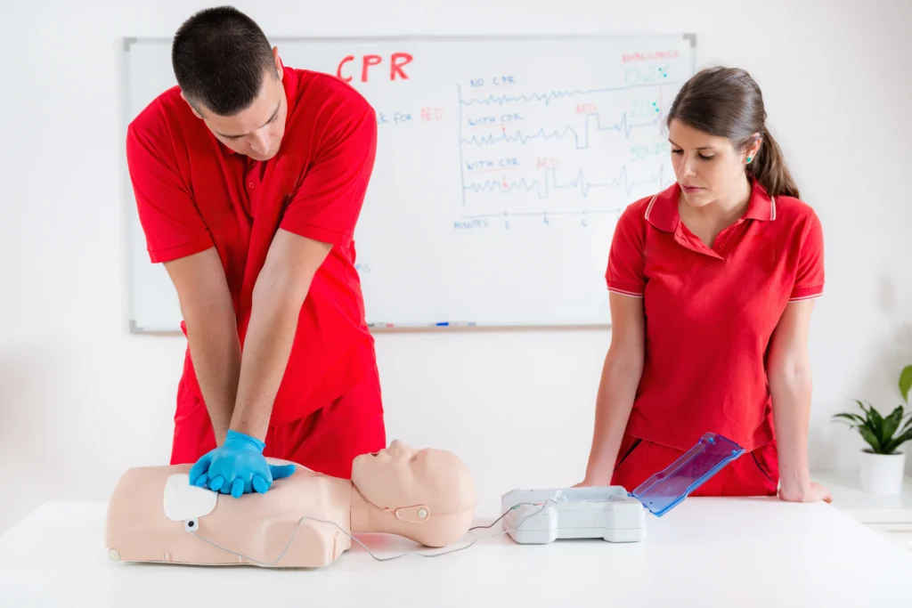 A nanny learing CPR and First Aid.