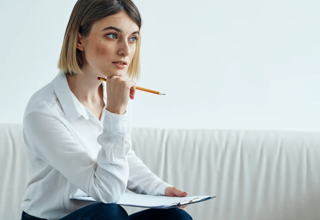 A woman prepairing questions regarding What To Ask Before Choosing Childcare