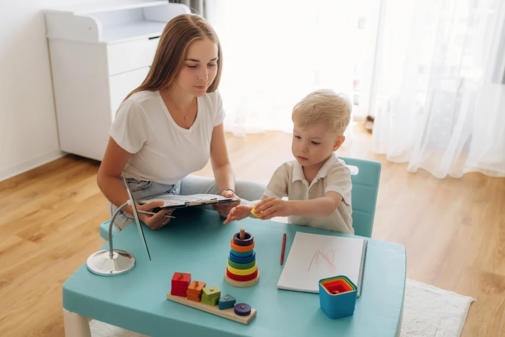 A nanny professional teaching a child.